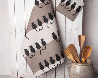 Handmade kitchen tea towel with a black cats design.