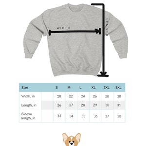 May include: A light gray sweatshirt with a size chart showing measurements in inches. The chart includes width, length, and sleeve length for sizes S to 3XL. The brand logo, a corgi illustration, is at the bottom.