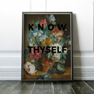 May include: A framed rectangular wall art print featuring a classical floral still life painting in an orange vase. The bouquet includes white, pink, yellow, and blue flowers. The black text KNOW THYSELF is centered over the floral arrangement.