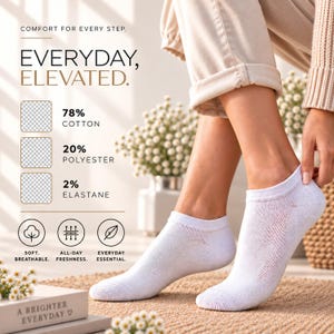May include: A pair of white ankle socks featuring a composition of 78% cotton, 20% polyester, and 2% elastane. The text on the image reads: Comfort for every step. Everyday, elevated. Soft, breathable. All-day freshness. Everyday essential.