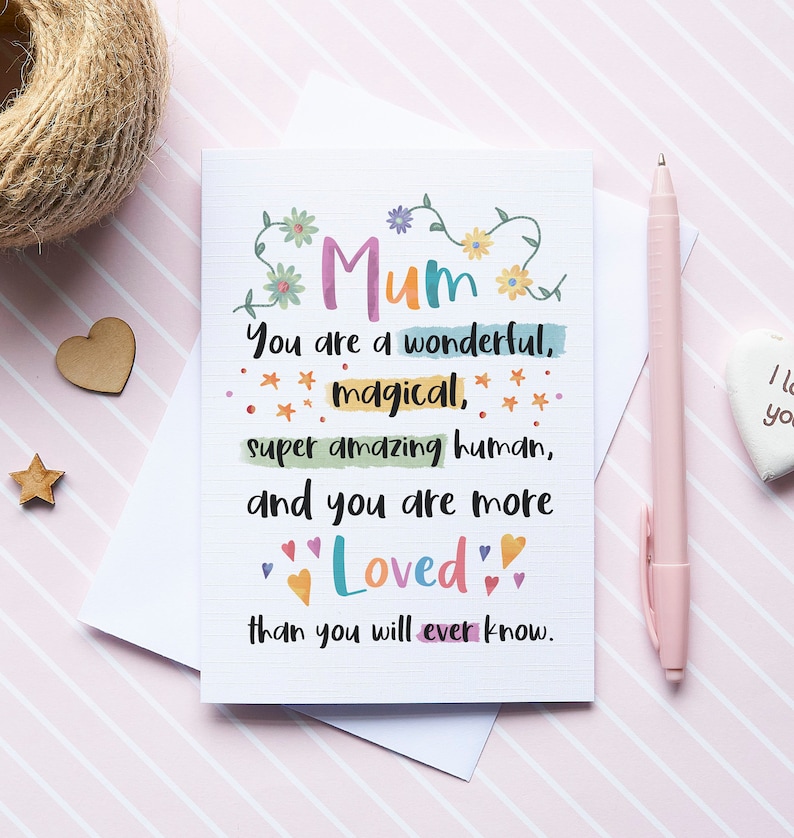 May include: A colourful card with the text "Mum You are a wonderful, magical, super amazing human, and you are more Loved than you will ever know."
