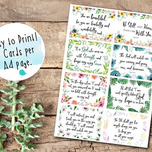 May include: Eight printable cards with inspirational quotes and floral designs. The cards feature watercolor floral illustrations and inspirational quotes from the Bible. The text on the cards includes quotes such as "You are beautiful, for you are fearfully and wonderfully made", "Be still and know that I am with you", "It is God who arms me with strength and keeps my way secure", "The Lord will watch over your coming and going now, and forevermore", "In the days when I cried out, you answered me & made me bold with strength in my soul", "Let all that I am wait quietly before God, for my hope is in him", "I will instruct you and teach you in the way you should go; I will counsel you and watch over you", and "For He shall give His angels charge over you to keep you in all your ways".