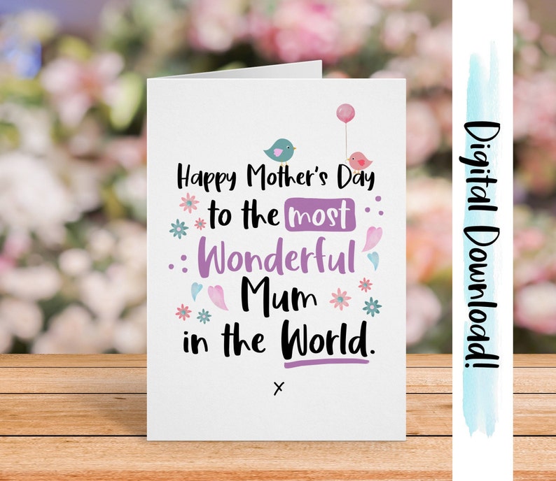 May include: A white card with a pink, purple, and blue floral design. The card says "Happy Mother's Day to the most Wonderful Mum in the World."