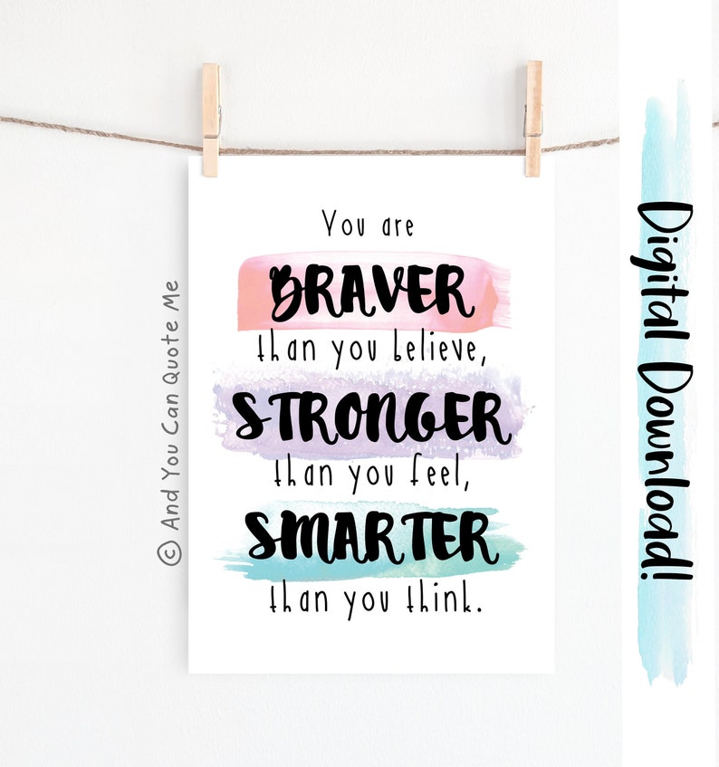May include: A printable digital download with a motivational quote: "You are BRAVER than you believe, STRONGER than you feel, SMARTER than you think." The quote is written in black text on a white background with colorful watercolor stripes behind each word.