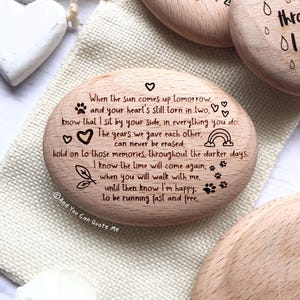 May include: Wooden heart-shaped keepsake with a message about remembering a loved one. The message reads: "When the sun comes up tomorrow and your heart's still torn in two, know that I sit by your side, in everything you do. The years we gave each other, can never be erased, hold on to those memories, throughout the darker days. I know the time will come again, when you will walk with me, until then know I'm happy, to be running fast and free. © And You Can Quote Me"