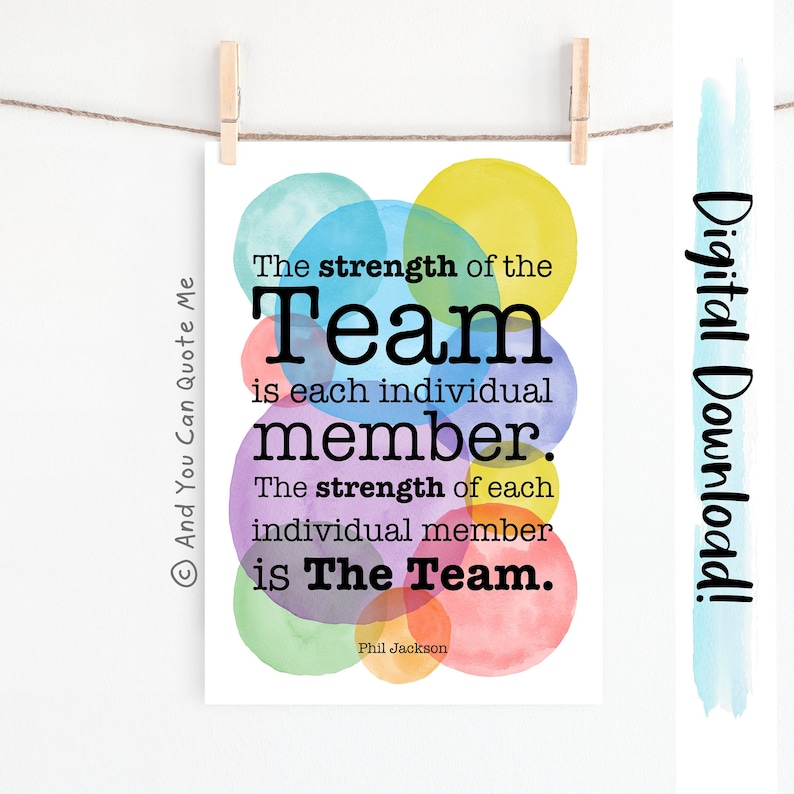 May include: A watercolor print with overlapping circles in shades of pink, blue, green, yellow, and orange. The quote "The strength of the Team is each individual member. The strength of each individual member is The Team." is printed in black text. The quote is attributed to Phil Jackson.