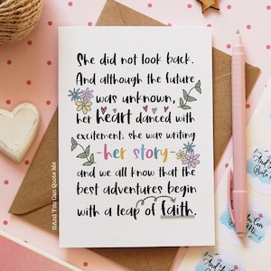 May include: A white card with a colorful floral design and the text "She did not look back. And although the future was unknown, her heart danced with excitement; she was writing -her story- and we all know that the best adventures begin with a leap of faith."