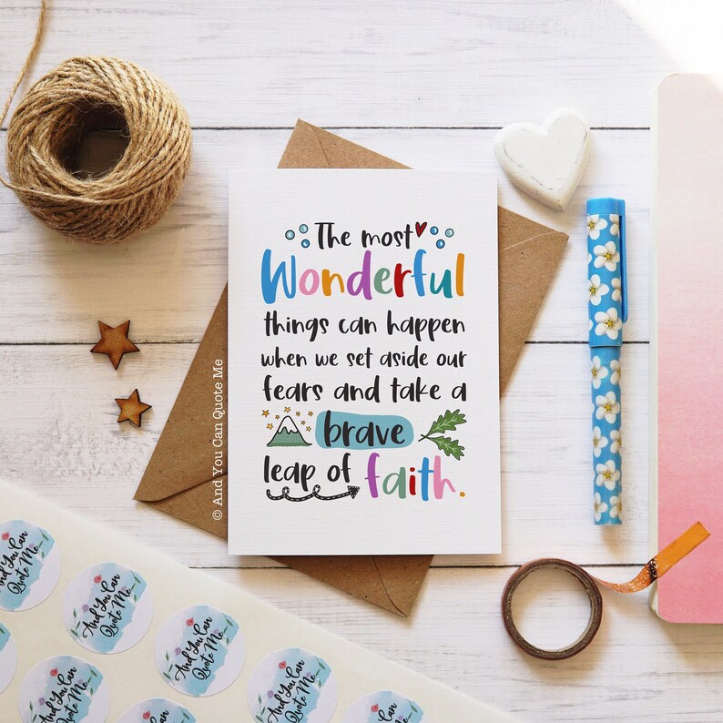 May include: A white card with a colorful quote that reads "The most wonderful things can happen when we set aside our fears and take a brave leap of faith."