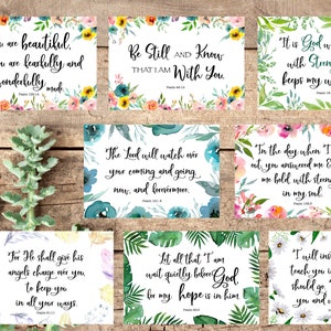 May include: A set of 8 printable cards with watercolor floral designs and inspirational quotes from the Bible. The quotes include verses about beauty, strength, hope, and faith.