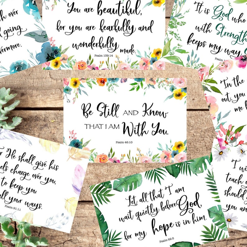 May include: A set of six inspirational cards with watercolor floral and tropical leaf designs. Each card features a different Bible verse and the corresponding Psalm number. The verses include "You are beautiful, for you are fearfully and wonderfully made. Psalm 139:14", "Be Still AND Know THAT I AM With You. Psalm 46:10", "It is God who with Strength keeps my way. Psalm", "In the out, you me", "He shall give his angels charge over you to keep you in all your ways. Psalm 91:11", and "Let all that I am wait quietly before God. For my hope is in him. Psalm 62:5".
