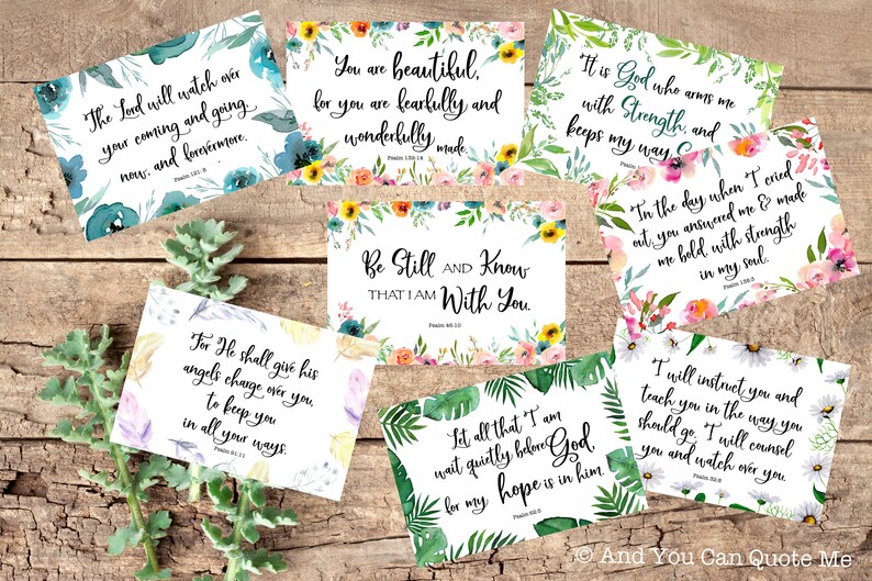 May include: A set of 10 printable inspirational quote cards with floral and tropical designs. The quotes are from the Bible and include verses like "The Lord will watch over your coming and going now, and forevermore." and "Be still and know that I am with you."