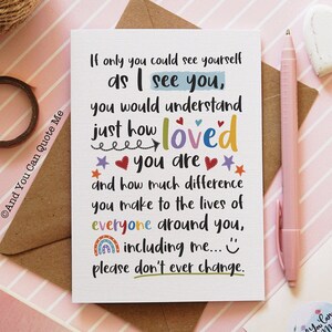 May include: A white greeting card with the text "If only you could see yourself as I see you, you would understand just how loved you are..." The card has colorful accents and is on a pink striped surface.