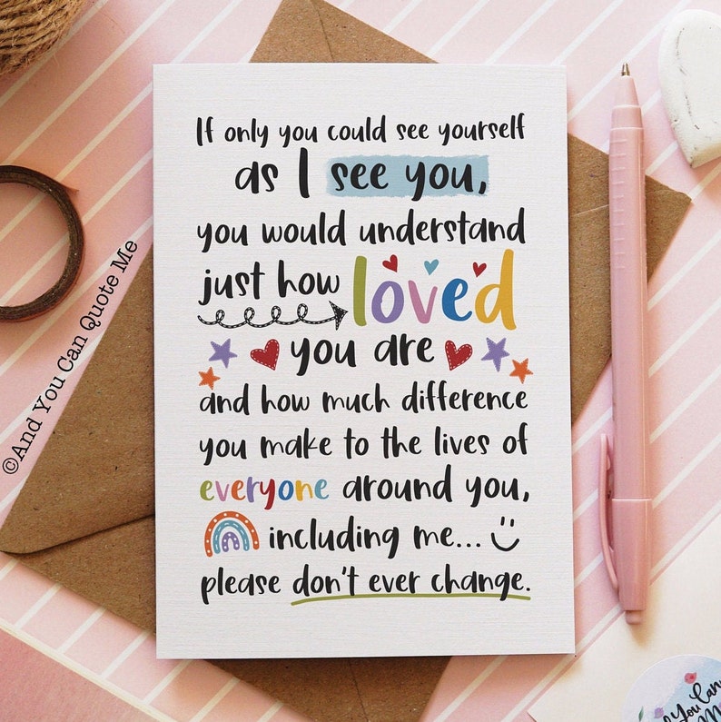 May include: A white greeting card with the text "If only you could see yourself as I see you, you would understand just how loved you are..." The card has colorful accents and is on a pink striped surface.