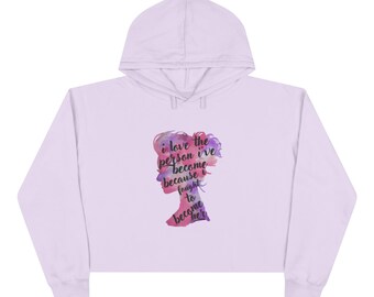 Felpa corta con cappuccio — Silhouette di ragazza ad acquerello "Amo la persona che sono diventata"