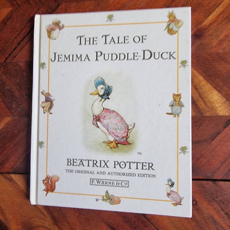 May include: The Tale of Jemima Puddle-Duck by Beatrix Potter, the original and authorised edition, illustrated children's book cover featuring a duck wearing a pink dress and blue bonnet.