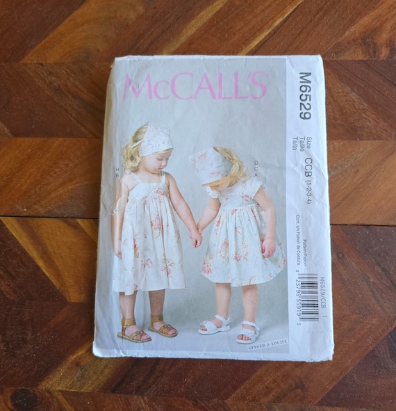 MCCALLS Patroon M6529 Meisjes Tops, Jurken en Shorts Maten 1-2-3-4