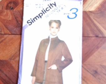 May include: Simplicity sewing pattern number 5263 for a brown jacket. The pattern is for size 3.