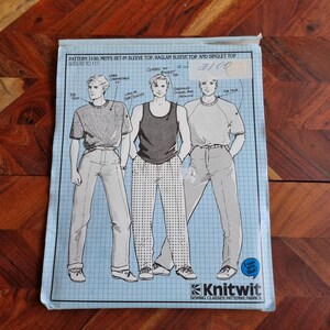 May include: A sewing pattern for men's tops, including a set-in sleeve top, a raglan sleeve top, and a singlet top. The pattern is for sizes 92 to 117. The pattern is from Knitwit Sewing Classes, Patterns, Fabrics. The price is £3.00.