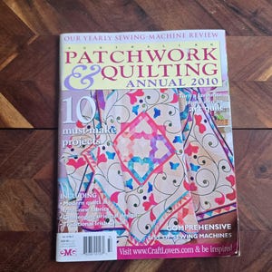 May include: A copy of the "Australian Patchwork & Quilting Annual 2010" magazine. The cover displays a vibrant quilt design with pink, blue, and purple hues. Text includes "10 must-make projects" and "Comprehensive list of sewing machines."