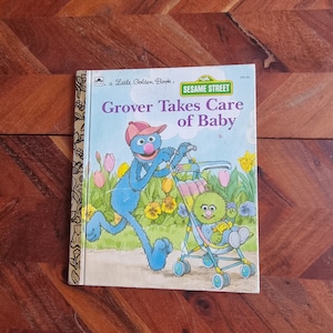 Livre pour enfants vintage - Little Golden Book - Sesame Street - Grover prend soin de bébé - Édition 1987
