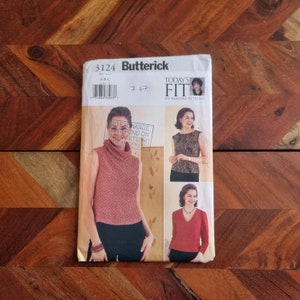 May include: A sewing pattern for a sleeveless top with a cowl neck. The pattern is from Butterick and is for sizes A-B-C. The pattern is called "Today's Fit" by Sandra Betzina.