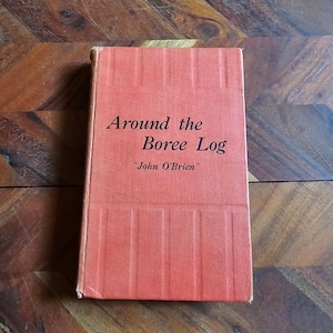Może przedstawiać: Czerwona książka w twardej oprawie zatytułowana "Around the Boree Log" autorstwa "John O'Brien".