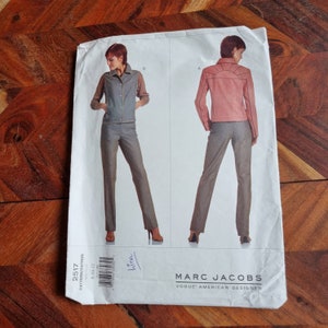 May include: A sewing pattern for a jacket and trousers. The pattern is for sizes 8-10-12. The pattern is by Marc Jacobs, Vogue American Designer.