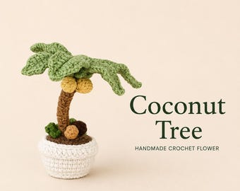 May include: A crochet coconut tree in a white pot with green leaves, a brown trunk, and yellow coconuts. The text Coconut Tree HANDMADE CROCHET FLOWER is printed to the right of the plant. The item is crafted from yarn with visible stitches.