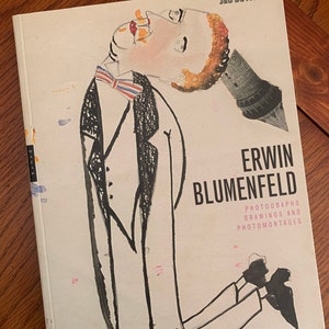 May include: A book cover with a black and white illustration of a person wearing a suit and bow tie. The title of the book is "Erwin Blumenfeld: Photographs, Drawings and Photomontages".