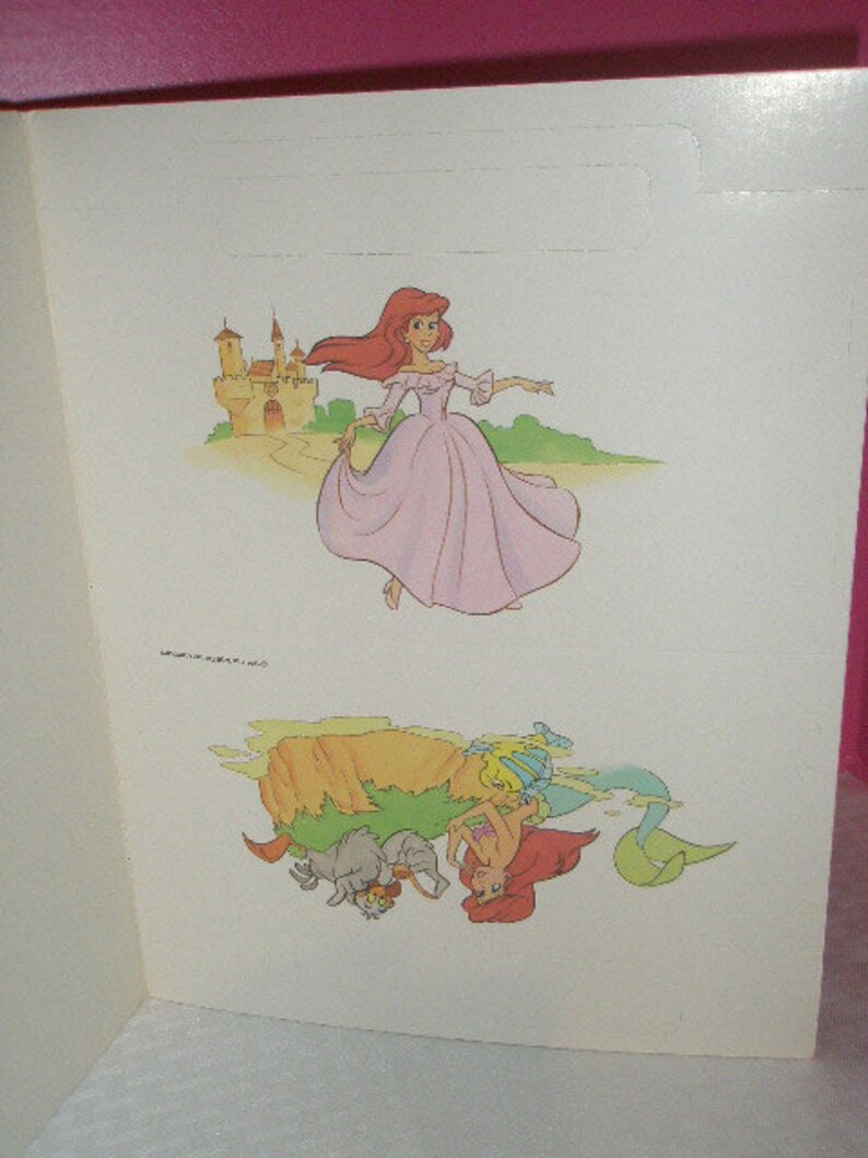 May include: A double-page spread featuring illustrations from a children's story. The top illustration depicts a princess in a pink gown near a castle. The bottom illustration shows mermaids and sea creatures.
