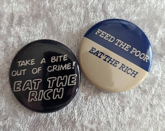 Set of 2 "Eat The Rich" Pinback Buttons - 1.5"