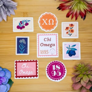 May include: A collection of colorful stickers with various designs. Some stickers resemble postage stamps, featuring floral and fruit illustrations, Greek letters, and the words "Chi Omega" and "1895".