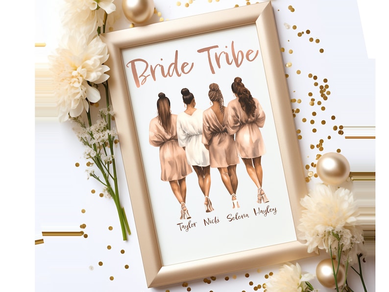 May include: A framed print with the text "Bride Tribe" at the top.  Four women in robes are standing in a row, facing away from the viewer.  The names "Taylor, Nicki, Selena, Hayley" are written below the women.