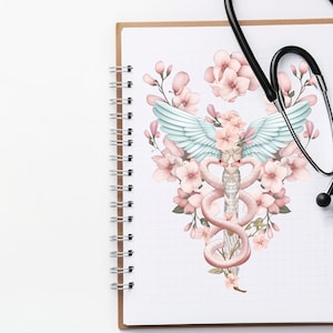 May include: A notebook with a spiral binding and a white background. The notebook has a drawing of a medical symbol with a snake wrapped around a staff, with wings and pink flowers.