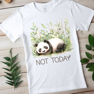 May include: White t-shirt with a watercolor illustration of a panda bear sleeping in a bamboo forest. The text "NOT TODAY" is printed below the panda.