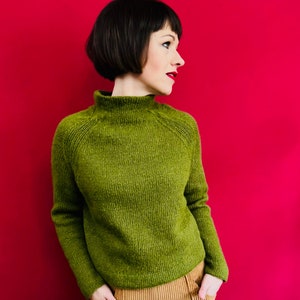 Knitting instructions for a classic short sweater with raglan sleeves and stand-up collar
