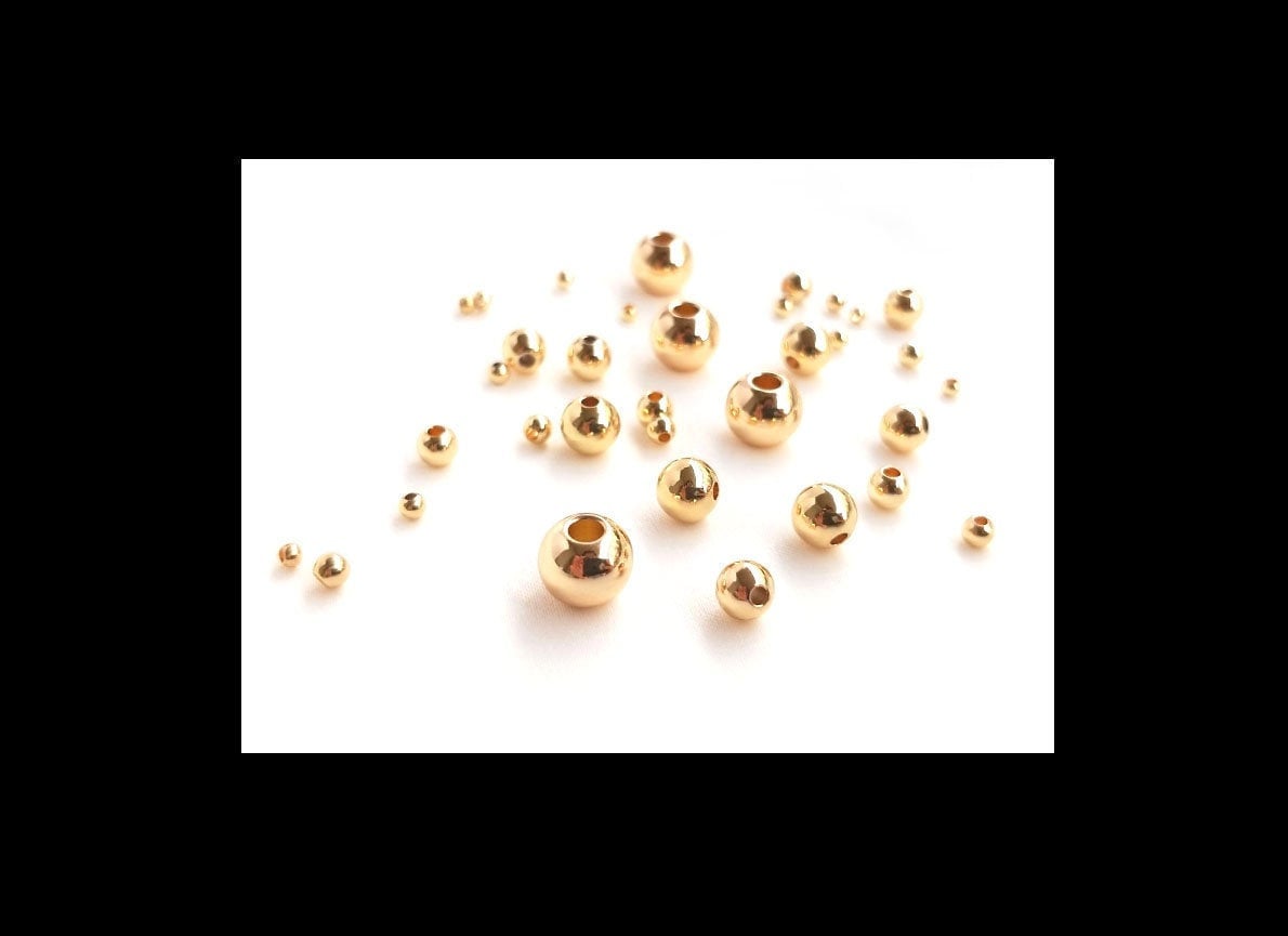 Perline rotonde in ottone placcato oro 14K con zirconia cubica blu