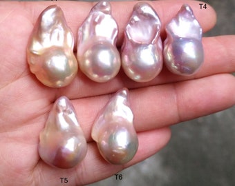 May include: Six iridescent baroque pearls in various shades of pink and white, labeled T1 through T6.