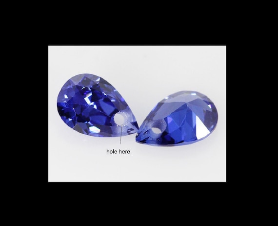 Tanzanite 7x6.2mm, 1.64 carats - Fantasy Cut Tanzanite - Oval Tanzanit – Sennin Esko Jewelry