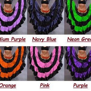 May include: Six different colors of a layered, ruffled skirt with a black waistband. The colors are medium purple, navy blue, neon green, orange, pink, and purple.