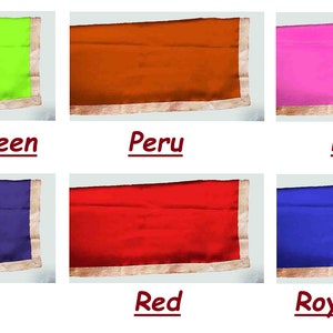 May include: Six fabric swatches in different colors: parrot green, peru, pink, purple, red, and royal blue. Each swatch has a gold trim.
