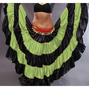 May include: A black and lime green layered satin skirt with a ruffled hem. The skirt is designed for belly dancing and has a decorative coin belt.
