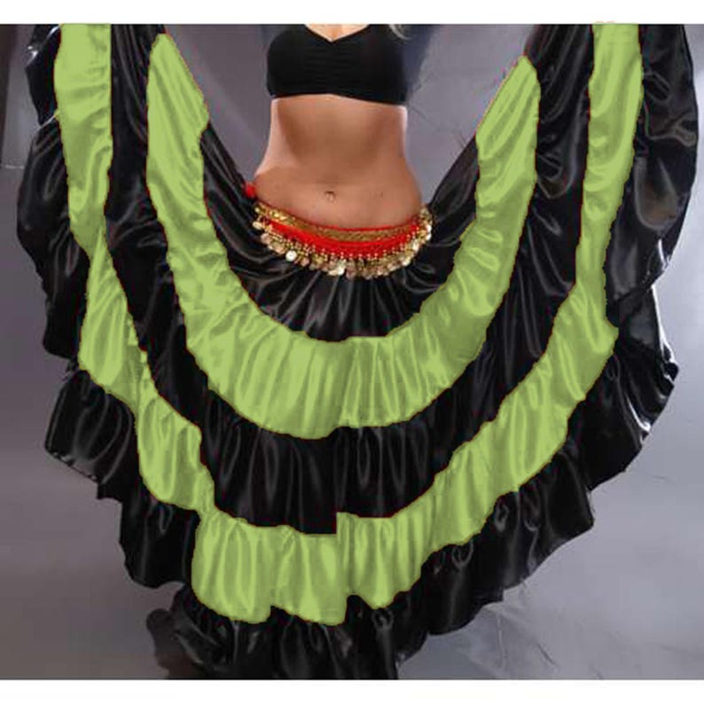 May include: A black and lime green layered satin skirt with a ruffled hem. The skirt is designed for belly dancing and has a decorative coin belt.