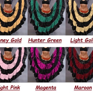 May include: Six different colors of a layered, ruffled skirt. The skirt is black with a contrasting color ruffle. The colors are honey gold, hunter green, light gold, light pink, magenta, and maroon.