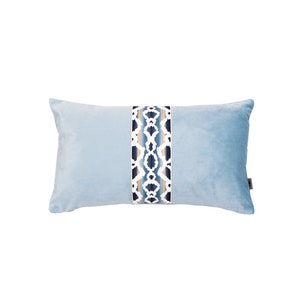 May include: A light blue rectangular pillow with a decorative blue, white, and beige patterned band down the center.
