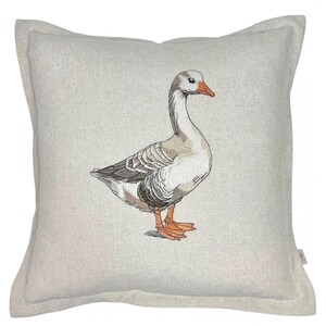 May include: A beige linen pillow with an embroidered image of a gray goose with an orange beak and feet.