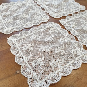Set of four embroidered cotton net Doilies /coasters