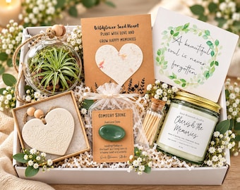 May include: A gift box containing a glass terrarium with an air plant, a card with a heart-shaped seed paper, a card reading A beautiful soul is never forgotten, a ceramic heart ornament, a green aventurine comfort stone, and a candle.
