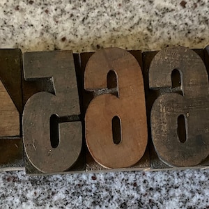 May include: A set of wooden printing blocks with the numbers 1, 2, 3, 4, 5, 6, 7, and 8.