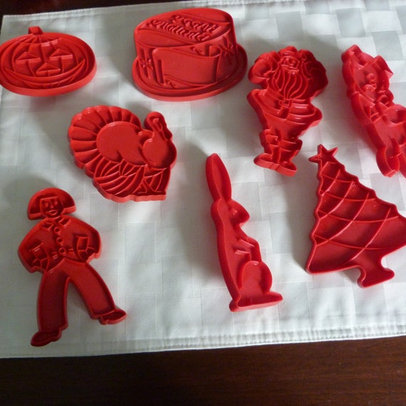 Tupperware red plastic holiday cookie cutters - vintage baking